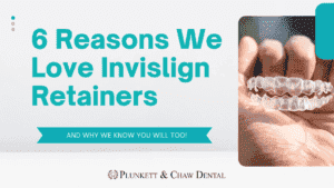 Hand holding a clear Invisalign retainer, illustrating why you need a retainer after Invisalign