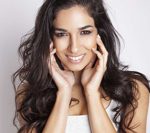 Patient smiling after in-office Zoom teeth whitening at Plunkett & Chaw Dental in Dunwoody, GA